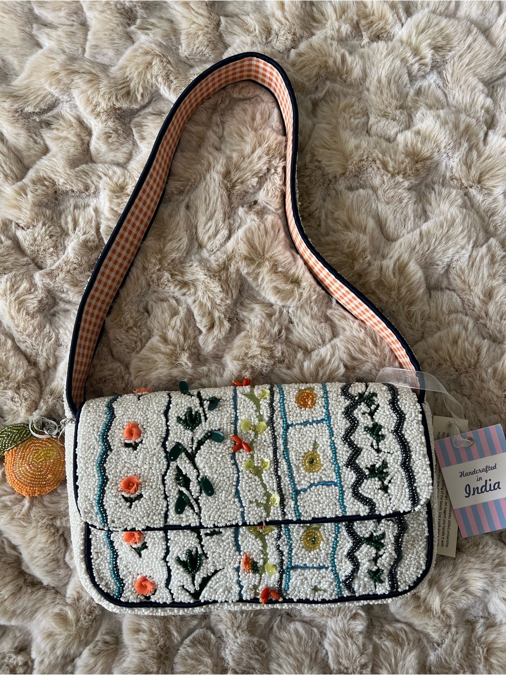 Handcrafted White Beaded Floral Shoulder Bag with Orange Charm